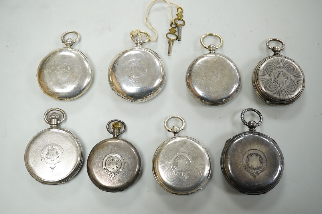 Seven assorted mainly early 20th century silver open faced pocket watches including a chronograph by William Williams of Bury, case diameter 53mm and one other silver pocket watch case(no movement).